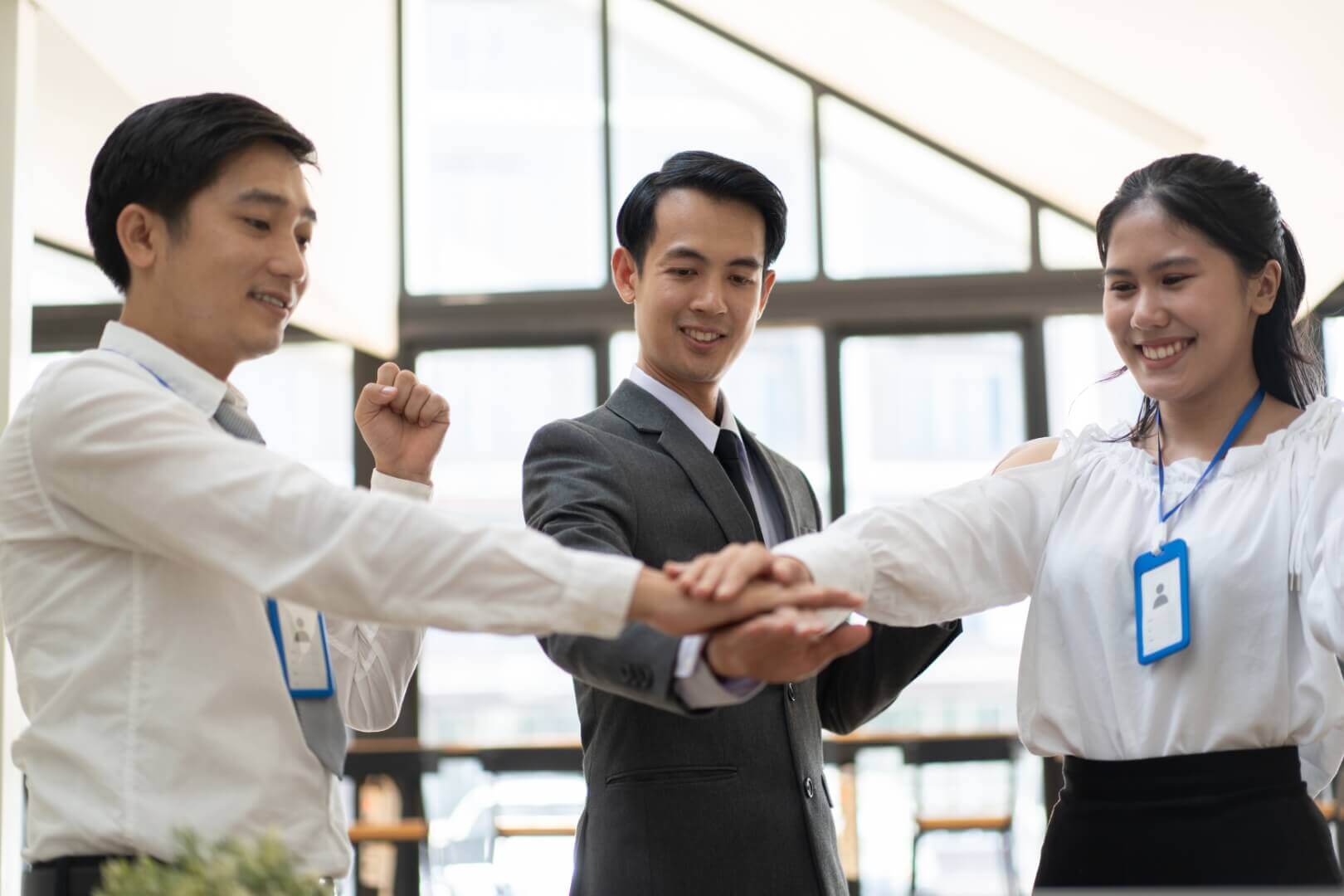 young business people putting their hands together 2023 11 27 05 26 13 utc